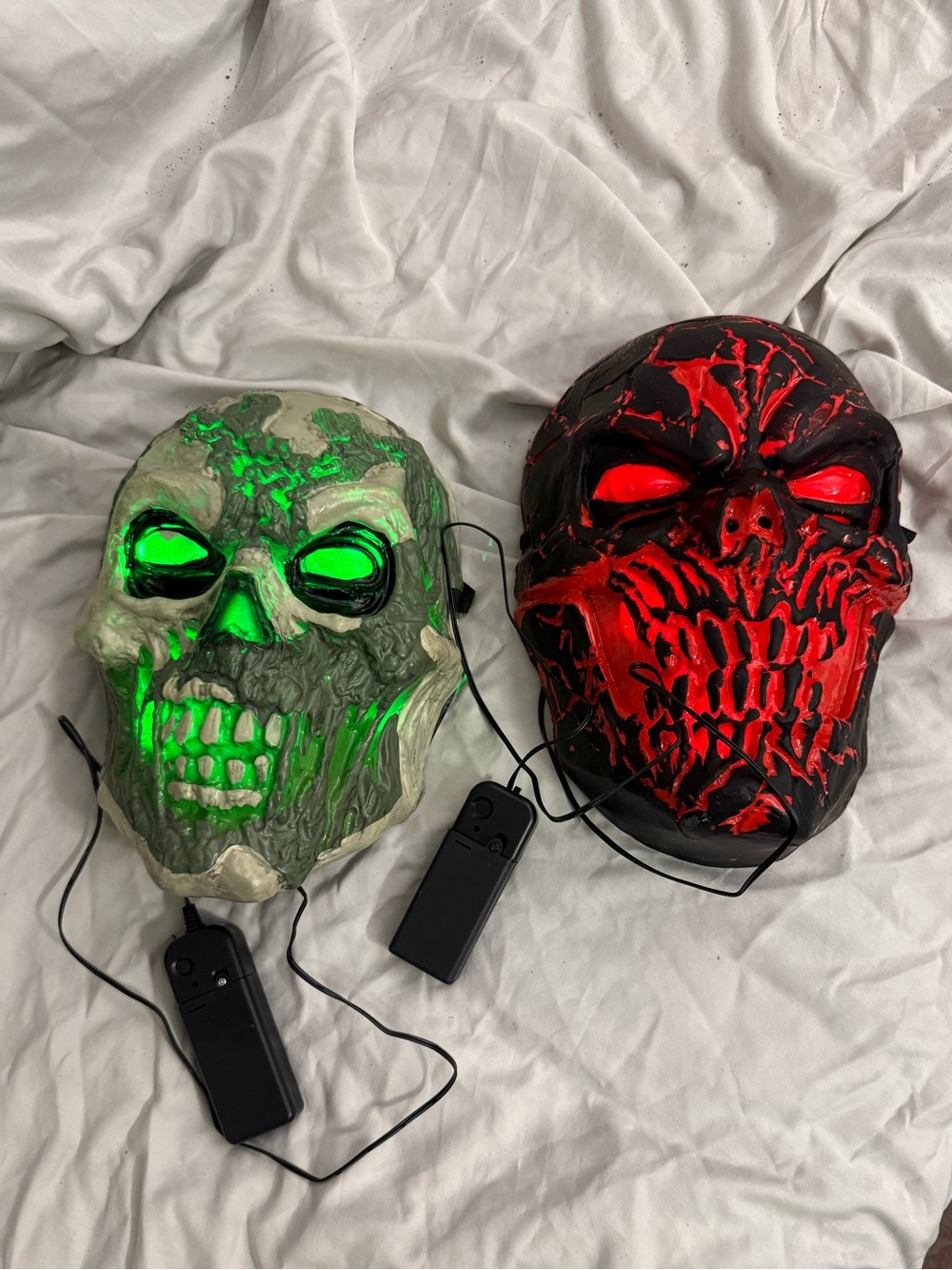 Set of two light up LED Halloween Skull Masks - Green and Red